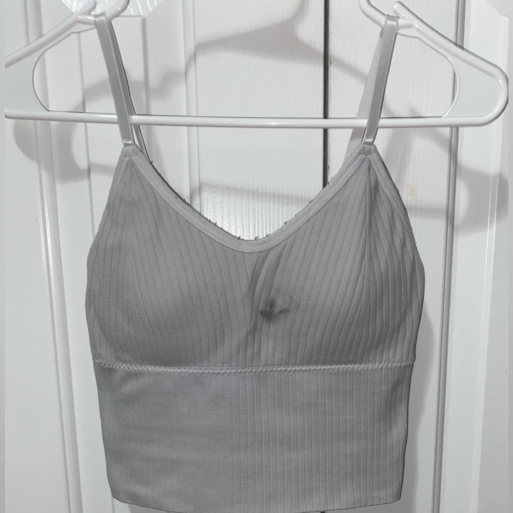 White ribbed sports tank with removable pads.